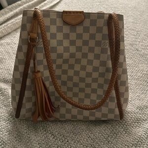 White checkered patterned LV bag with defect. Inside is pink suede